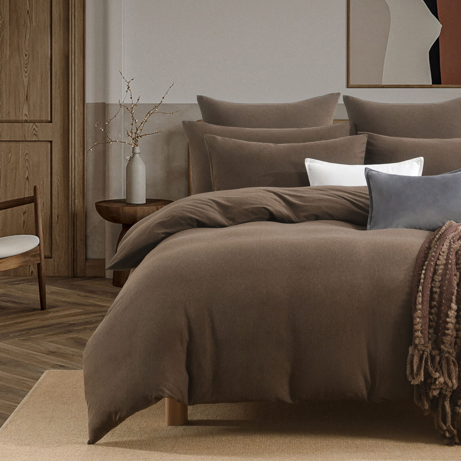 Jersey Chocolate cotton quilt cover styled with warm neutral pillow layers