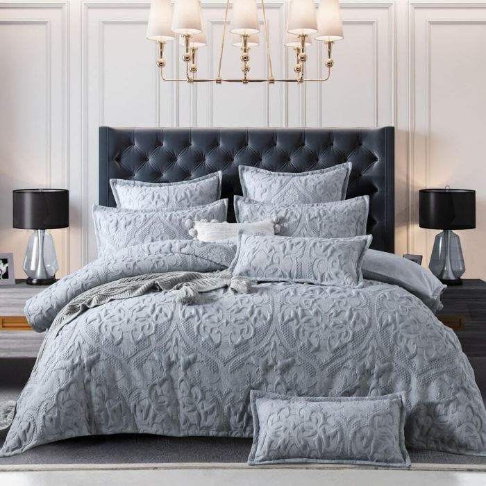 a bed with Amari grey quilt cover from Manchester Collection