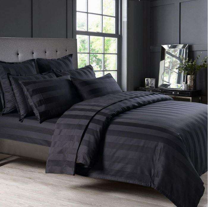 Black sheet and pillows on a bed