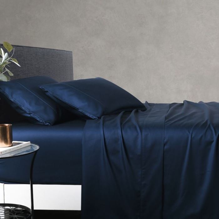 Blue bed sheet set on a bed