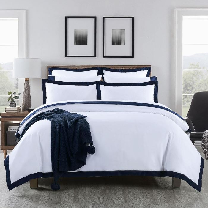 A bed with Plaza 1000tc Quilt Cover from Manchester Collection