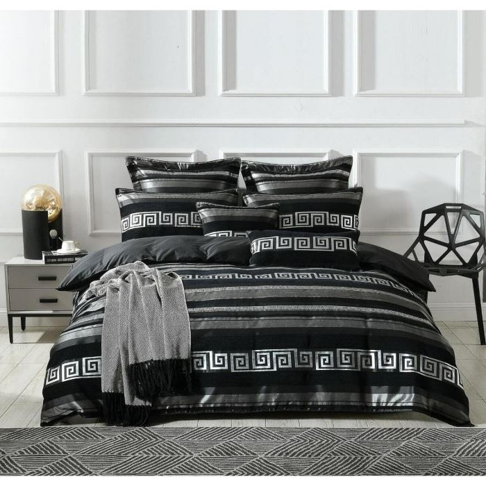 A bed with silver-black quilt cover