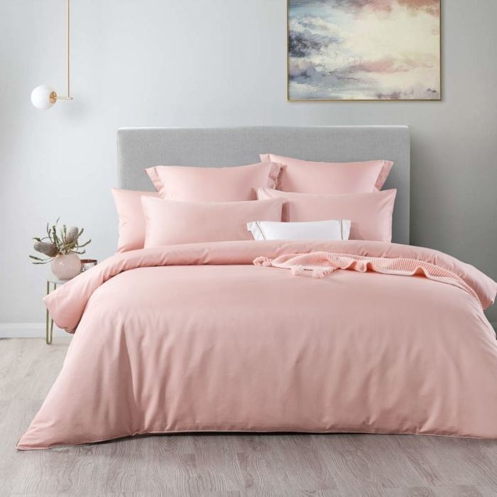 Pink quilt cover on a bed