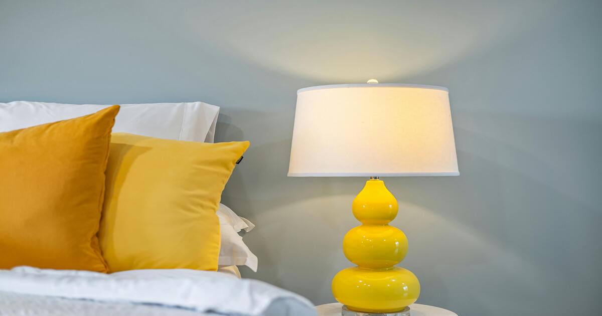 How to style a guest bedroom - have a bedside lamp for the comfort of guests.