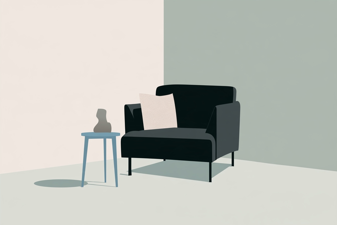 A dark contemporary armchair with a pale cushion beside a blue table and small sculptural vase.
