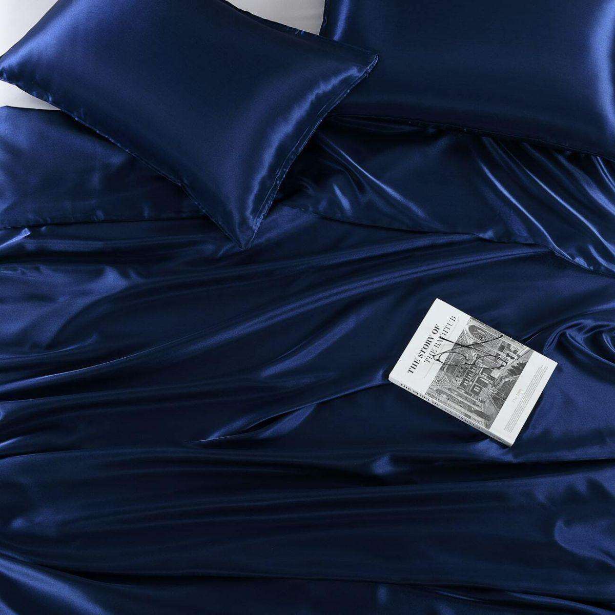A close-up image of satin bed sheets.