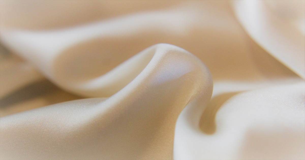 A close up image of sateen sheets.