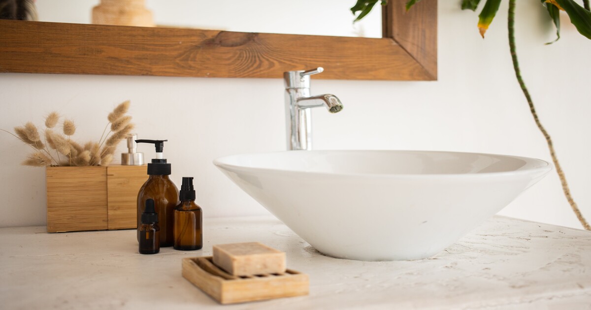 A sink with stylish bathroom accessories. 