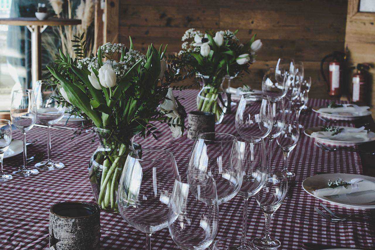 A dinning table with minimalist yet beautiful table settings.