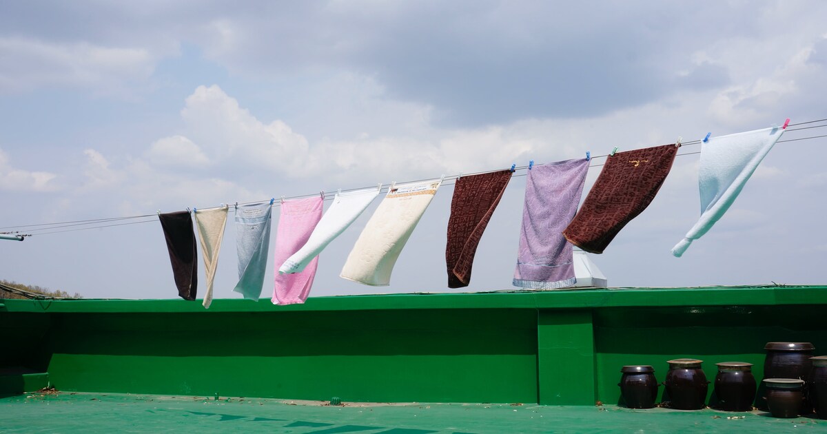 Clean towels hanging on a clothesline.