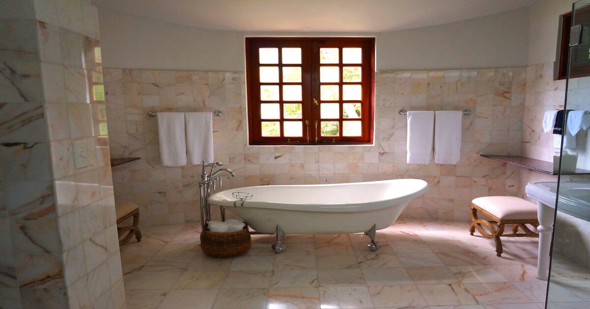 A freestanding tub in a modern bathroom.