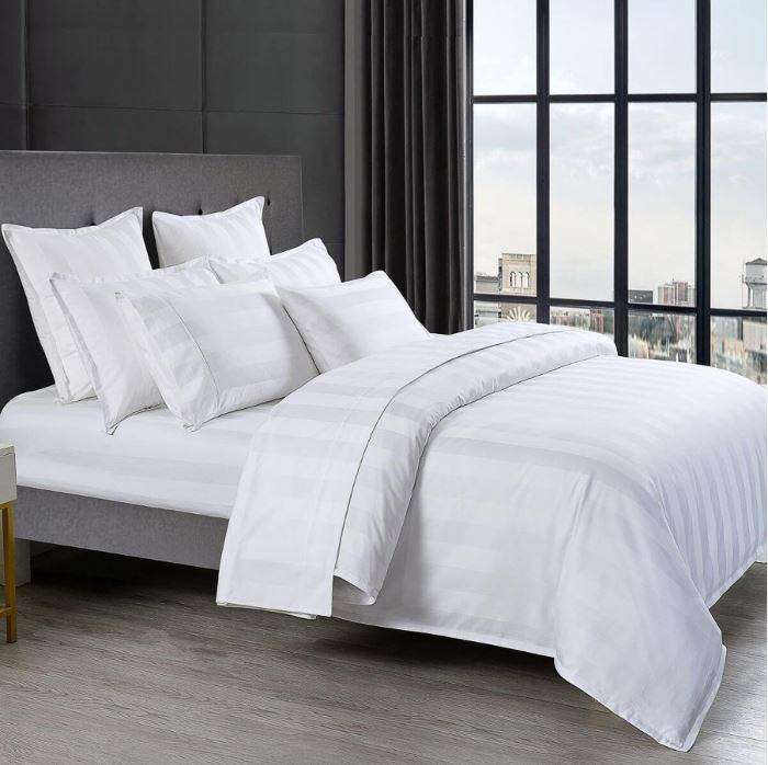 White bed sheet set on a bed - Manchester Collection