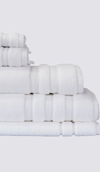 Folded white bath towels