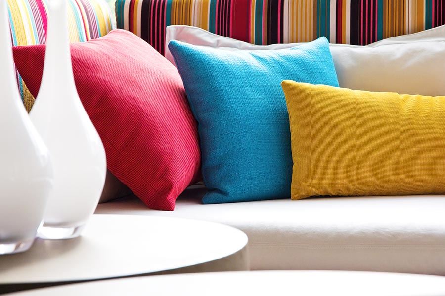 Using coloured cushions to brighten up your home main image